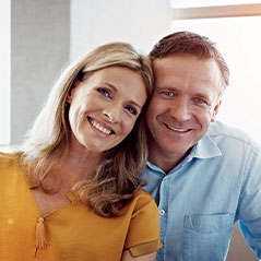 Couple smiling and looking at camera. Link to Life Stage Gift Planner Under Age 45 Situations