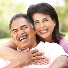 Middle aged couple smiling and laughing. Link to Life Stage Gift Planner Ages 45-65 Situations